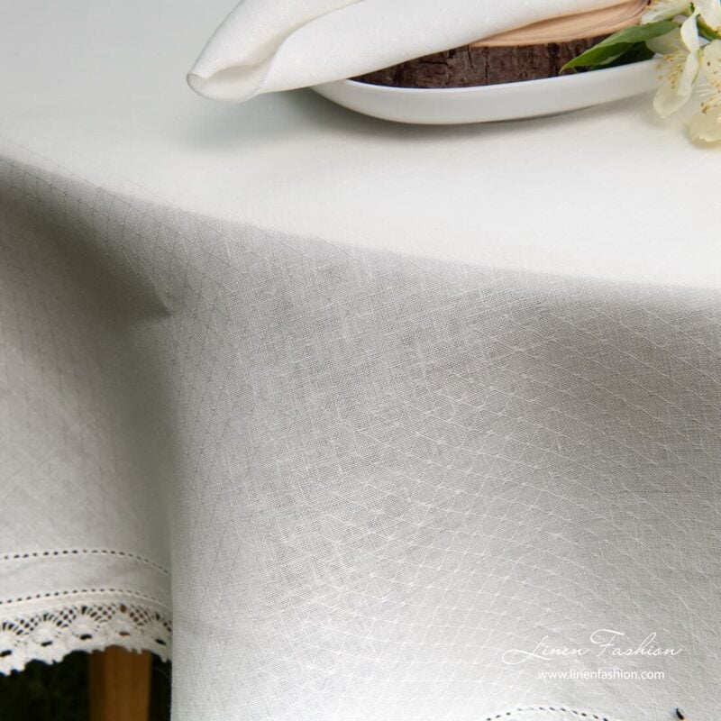 NORA linen round tablecloth, white colored.