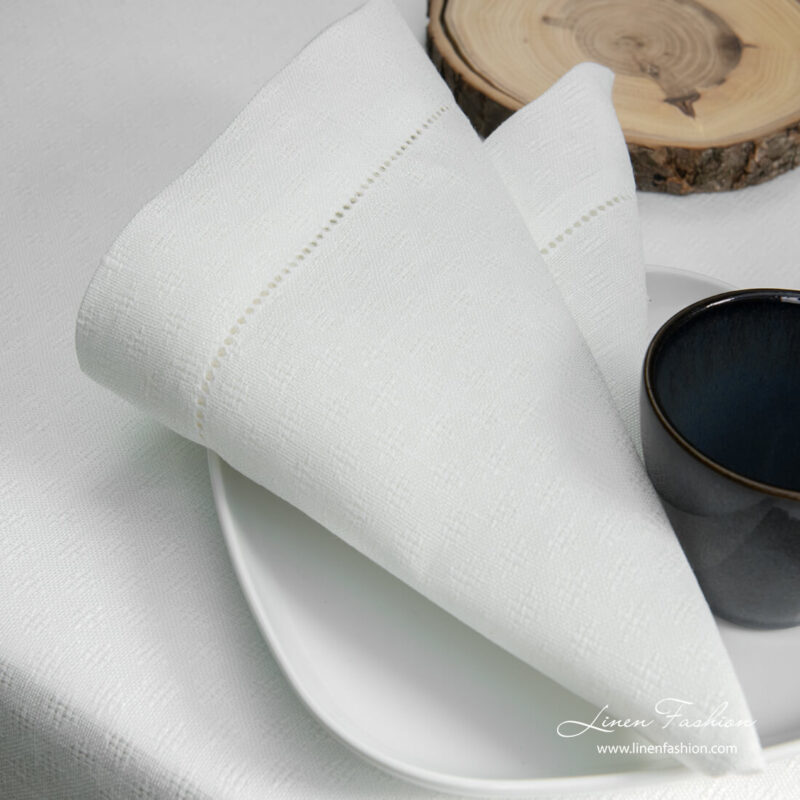 White patterned linen napkin with hemstitch