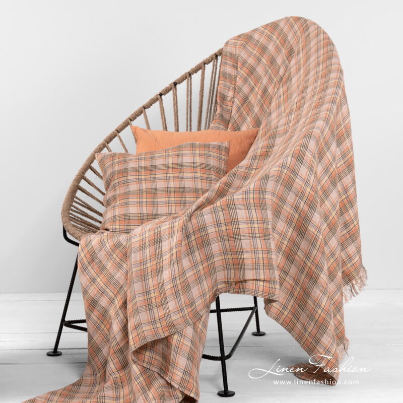 checked linen throw with cushions.