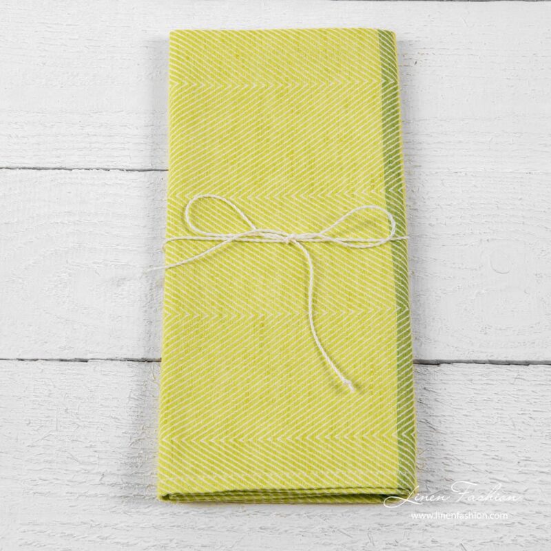 Kitchen towel in green color.