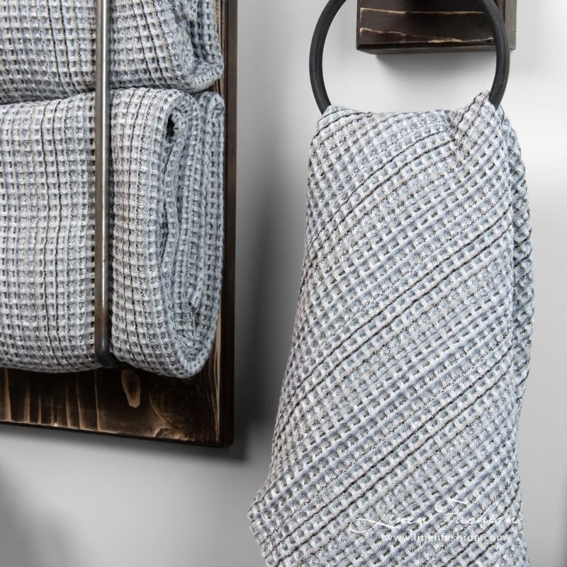 Waffle pattern gray bathroom towel with black stripes
