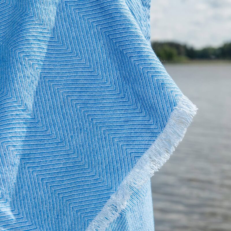Light blue herringbone linen cotton beach towel, with fringe