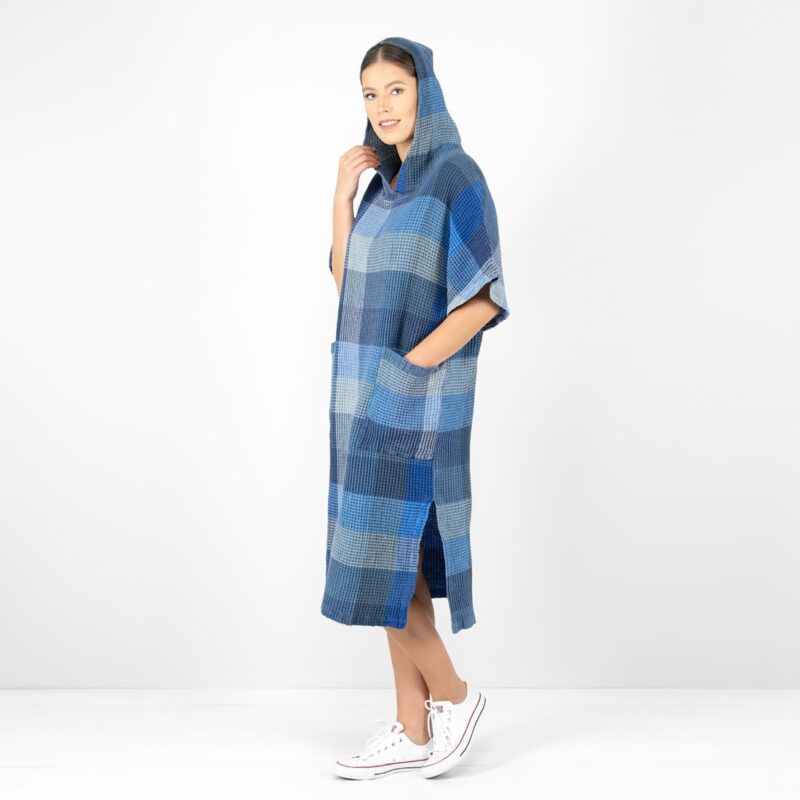 blue linen poncho with slits on sides.