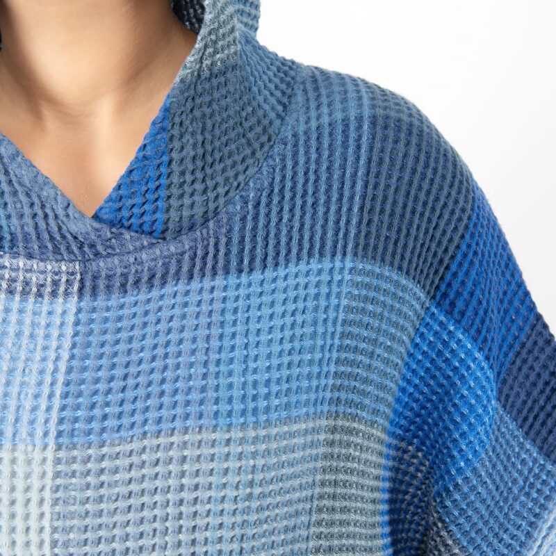 blue linen poncho waffle structure.