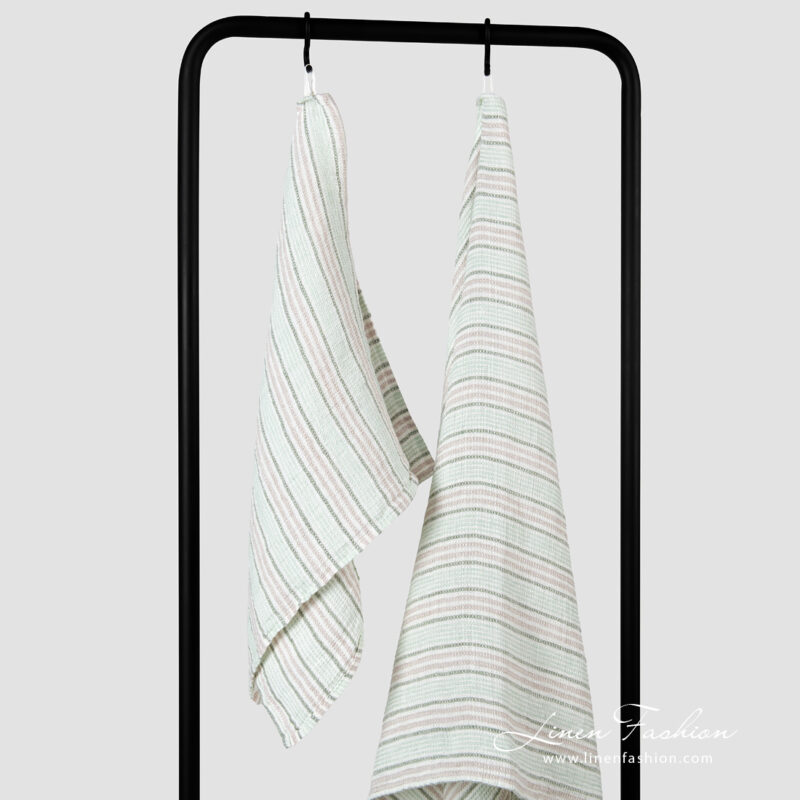 Linen green bath towel with grey green white stripes.