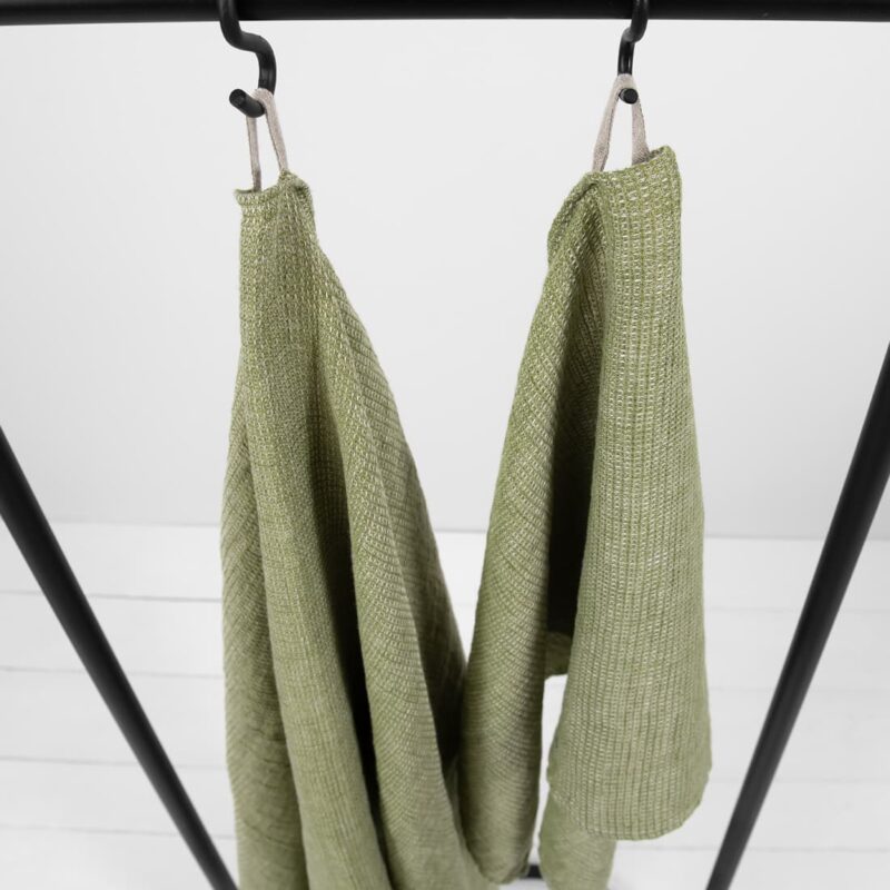 linen green waffle towel with hanger.