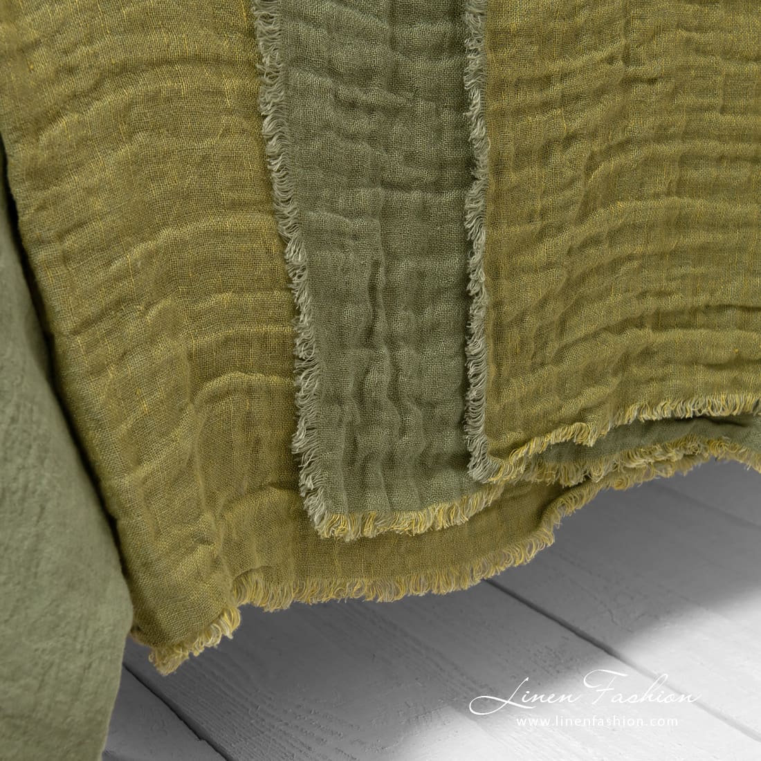 Linen green bedspread washed in different sizes.