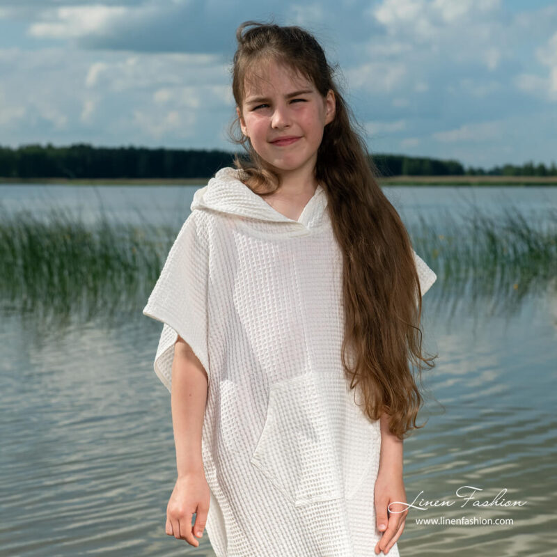 White childrens poncho in waffle pattern