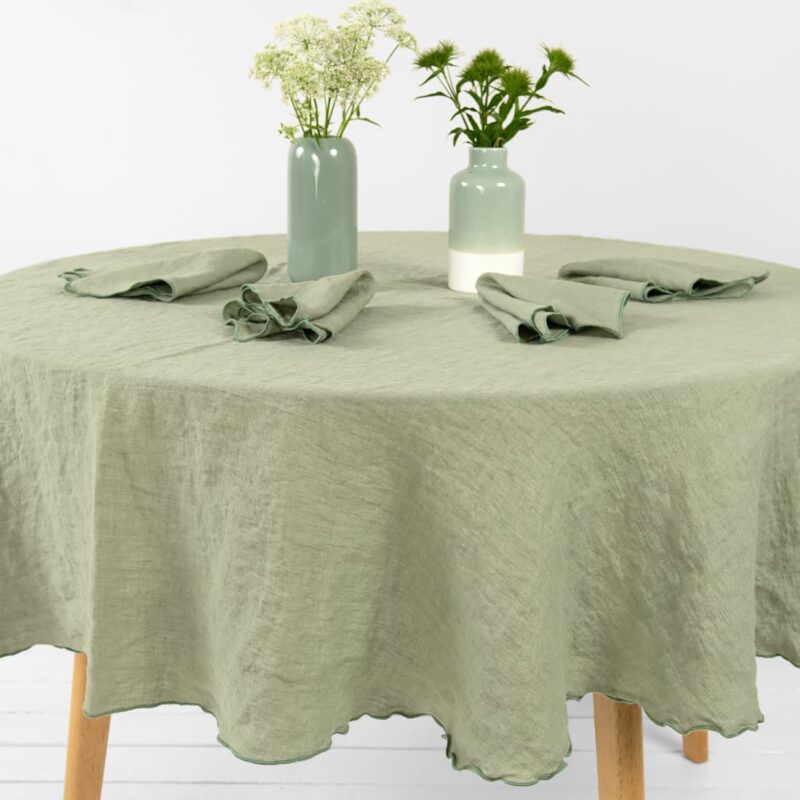 old green linen round tablecloth with napkins