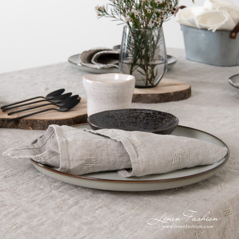 Linen napkin in grey color, solo.