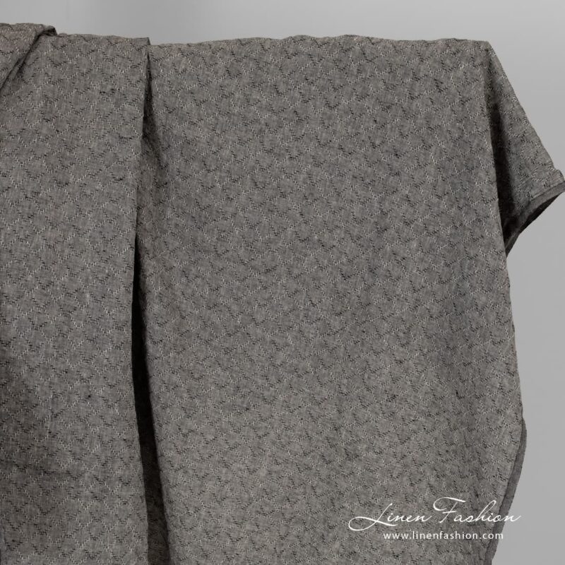 Black melange linen fabric with diamonds, washed.