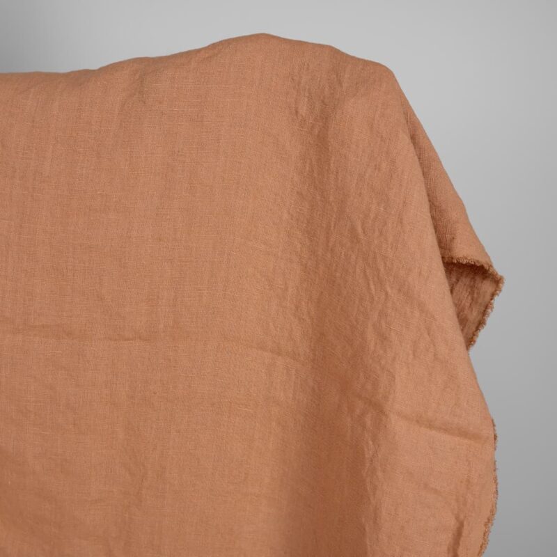 Linen washed fabric light brown color for sewing clothes and home textiles close view
