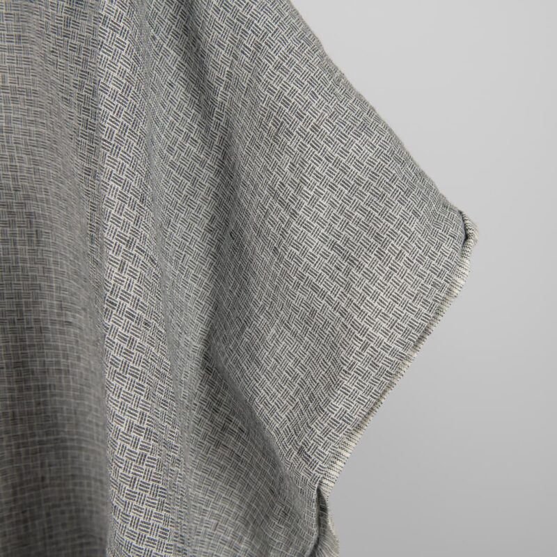 Linen fabric washed dark grey colour close up edge view