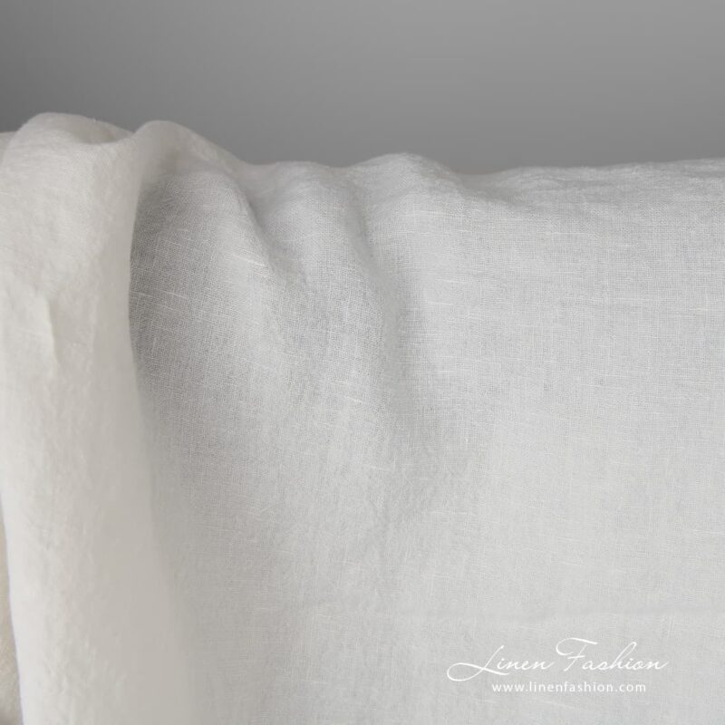 Wide washed linen fabric in off-white is ideal for bedding, kitchen textiles and curtains