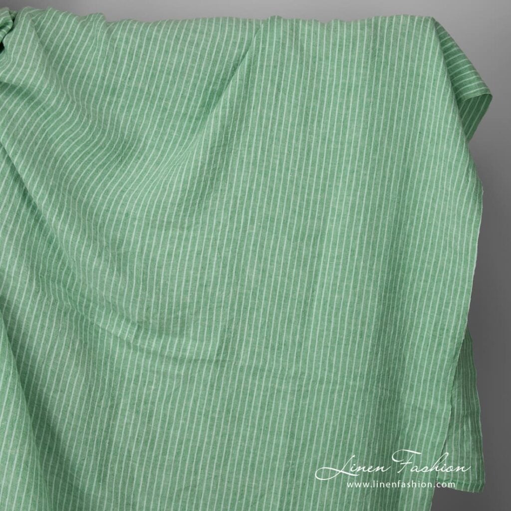 Wide washed green striped linen fabric