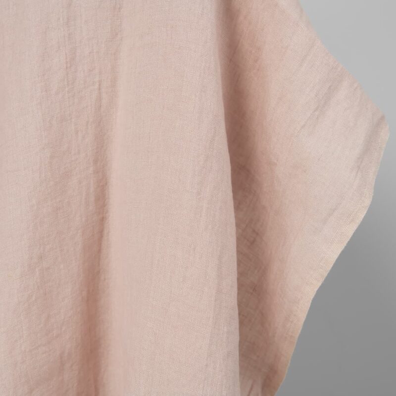 Washed linen fabric in light pink, fabric edge