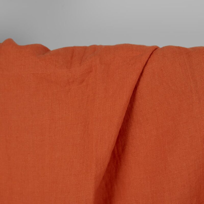 Washed linen fabric in dark orange, 100% linen