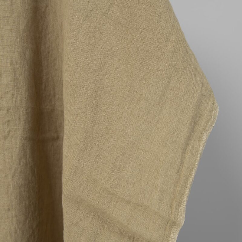 Washed linen fabric in greenish-beige, fabric edge