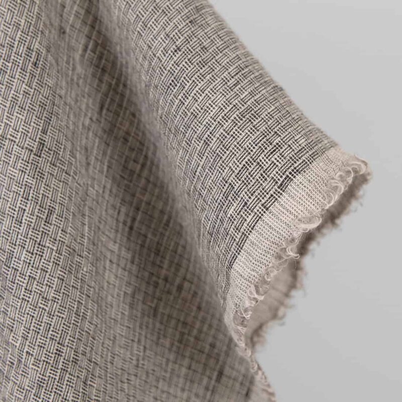 Washed linen fabric pink-black small pattern, fabric edge