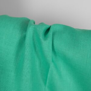 Pure linen fabric in green close up detail