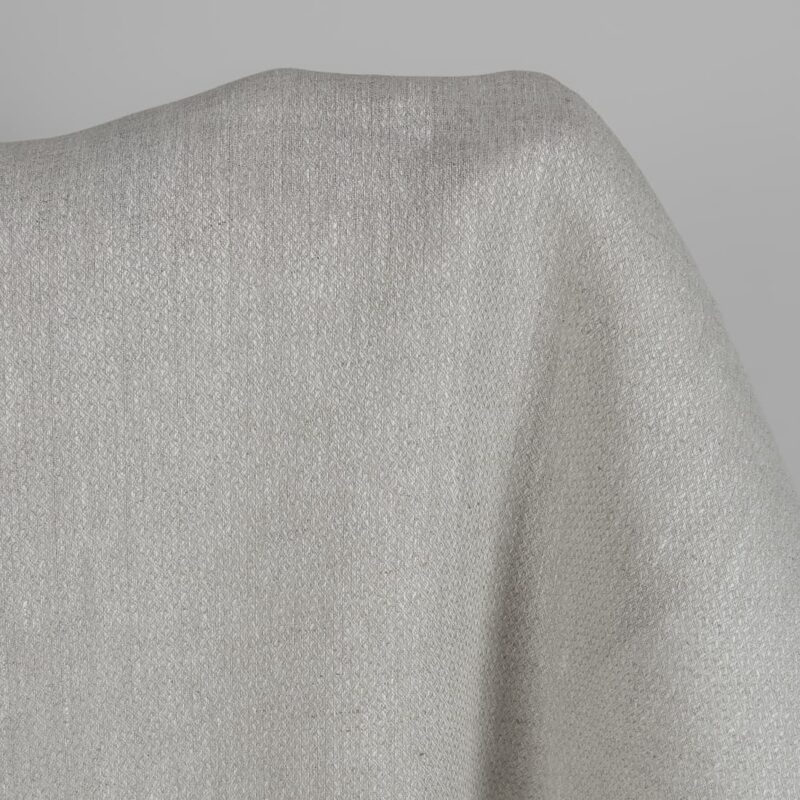 Beige linen fabric in a diamond pattern close up detail