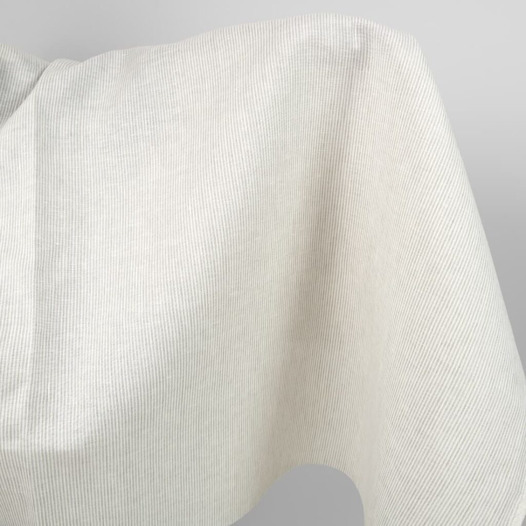 Linen fabric in natural and white colour stripes product close up view
