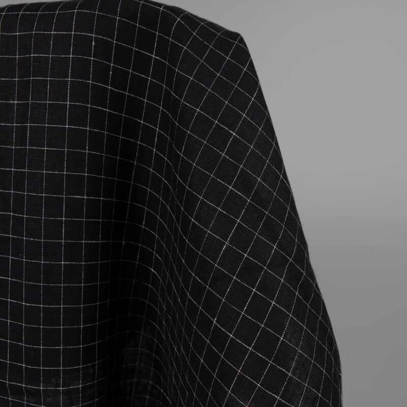 Black linen fabric white checks close up detail