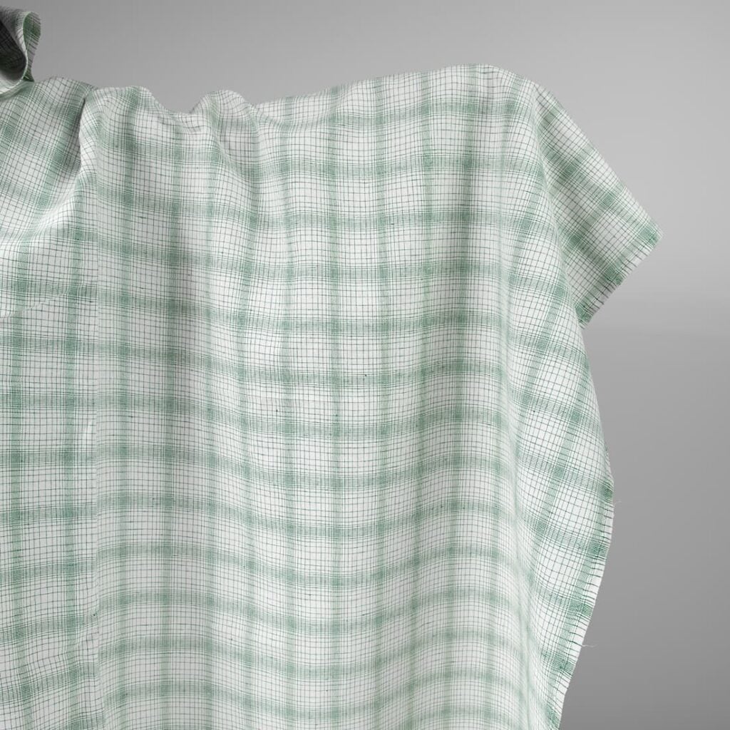 White linen cotton fabric with striped green checks