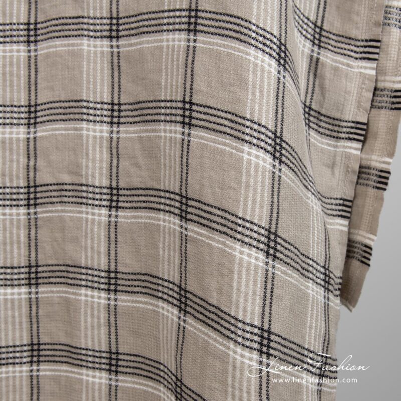 Grey brown linen fabric in checks, specially washed to increase softness