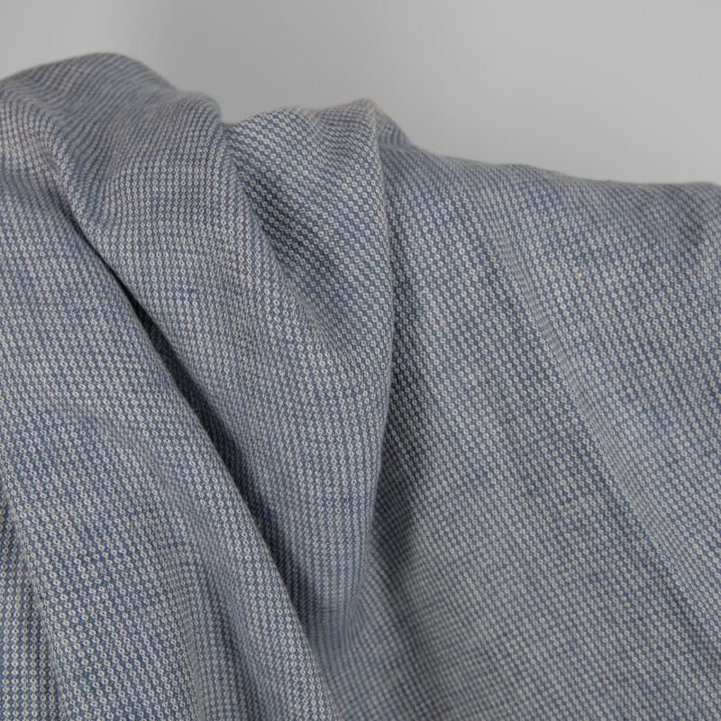 Washed linen fabric blueish grey colour small pattern detail view