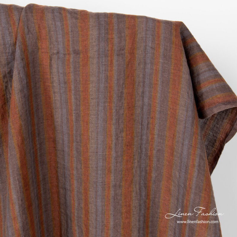 Linen fabric in brown grey vertical stripes, washed