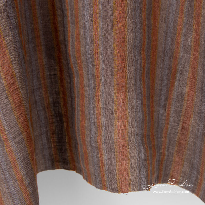Variable brown and grey stripe width linen fabric, washed