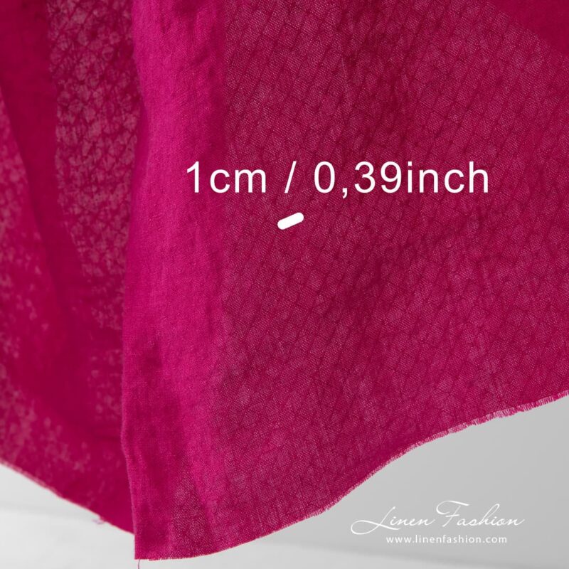 Washed bold berry coloured linen fabric.