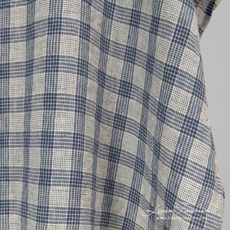 Washed cream colour linen fabric in checks.