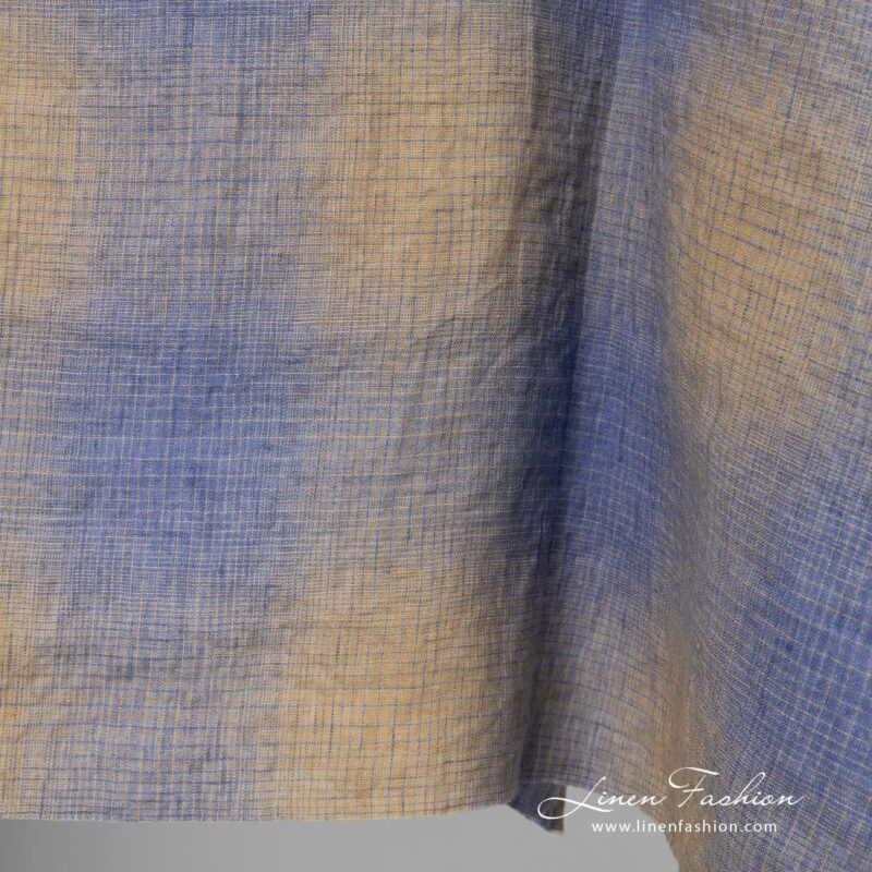 Checked linen fabric in blue and yellowish brown color, washed
