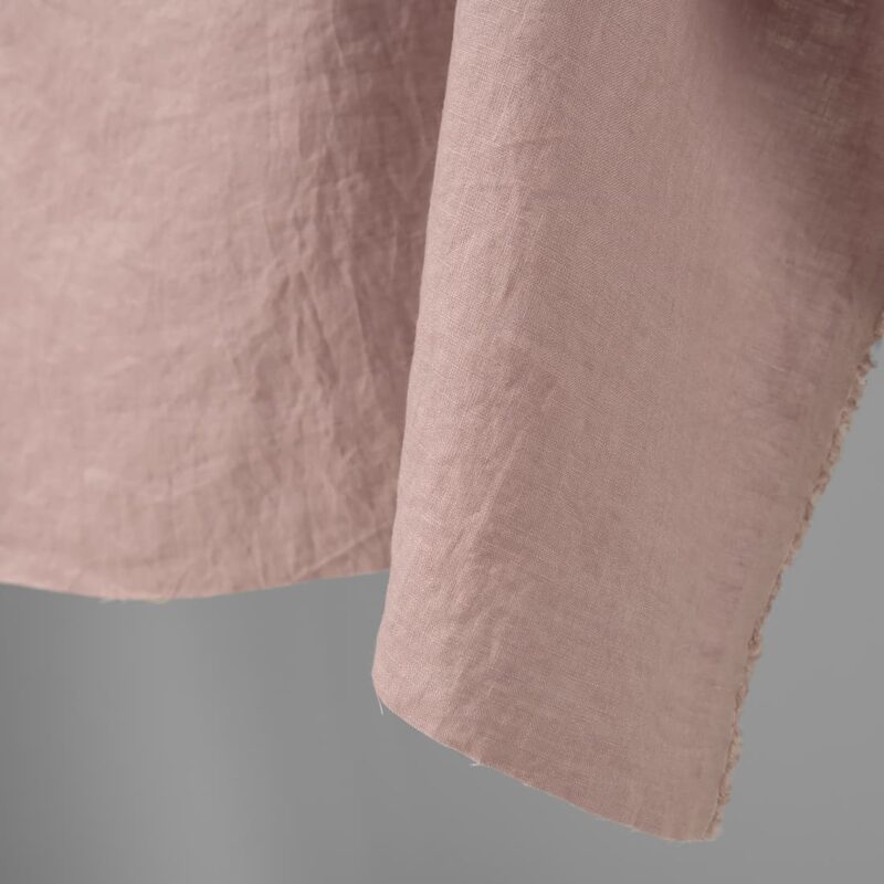 Washed linen fabric light lilac colour edge view