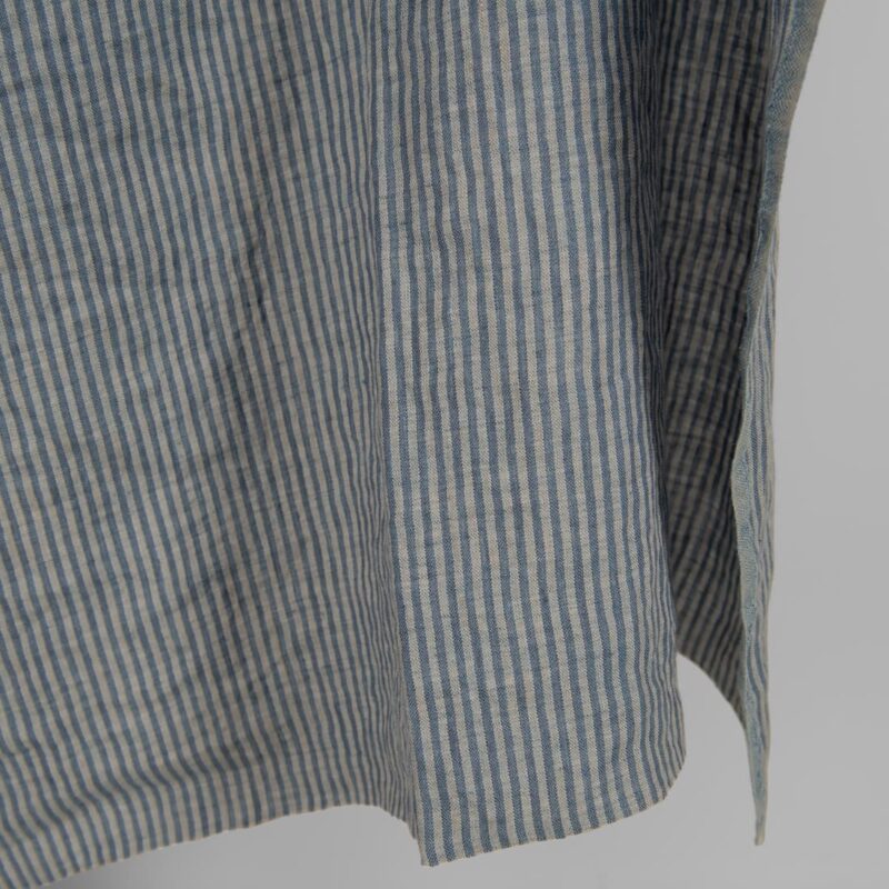 Washed linen fabric with blue stripes edge view