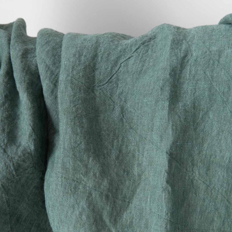 Washed green melange linen fabric