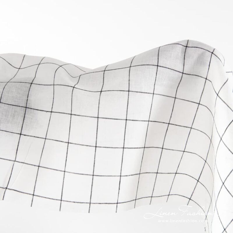 Off-white linen fabric with black grids.