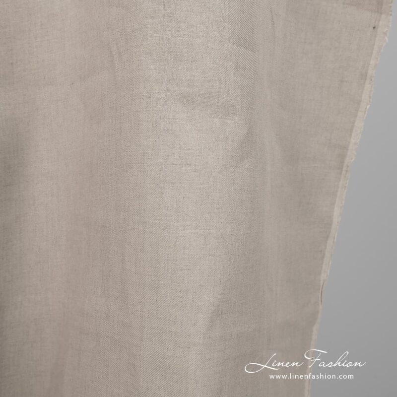 Linen fabric natural colour twill weave pattern close edge view