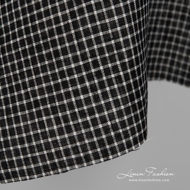 Black linen fabric with white checks close up detail view