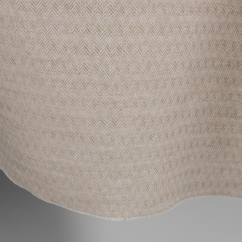 Brown and white linen cotton fabric in a herringbone pattern edge