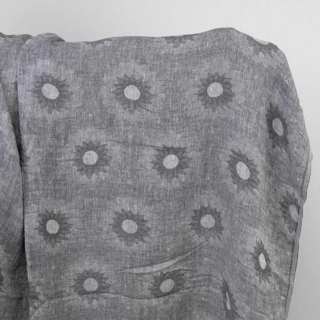 Grey linen fabric with floral pattern washed