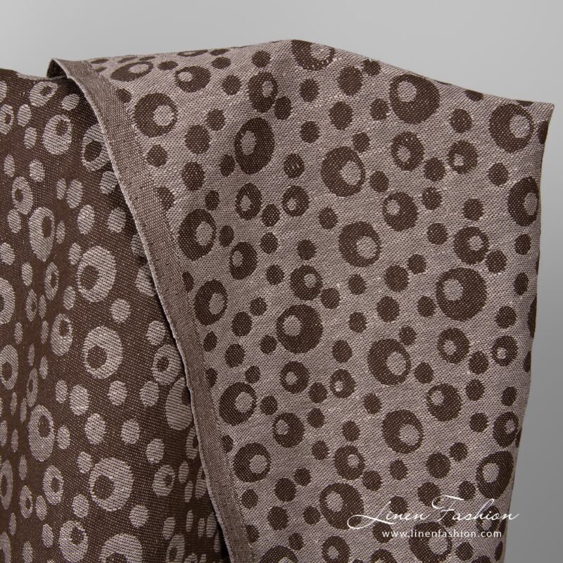 Brown fabric with bubbles.