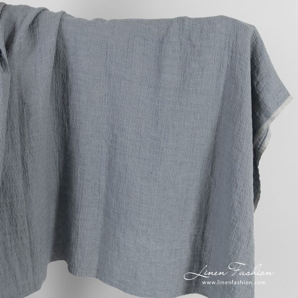 Bluish grey jacquard linen fabric in zigzag pattern