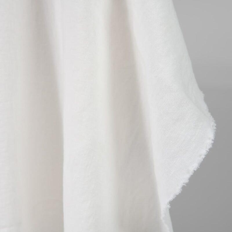 Washed heavy linen fabric off-white colour edge view