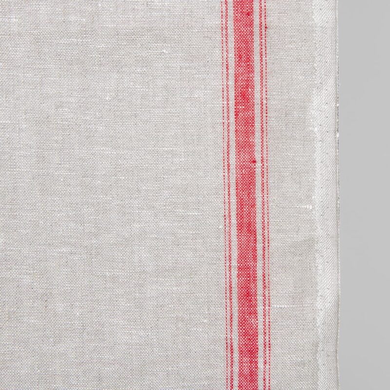 Narrow linen fabric light grey colour with red stripes close up edge