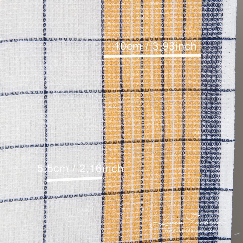 Optical white, pale orange and dark blue checked linen / cotton "waffle" fabric is ideal for sewing kitchen towels