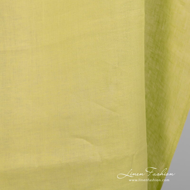 Linen fabric pale lime colour close up view