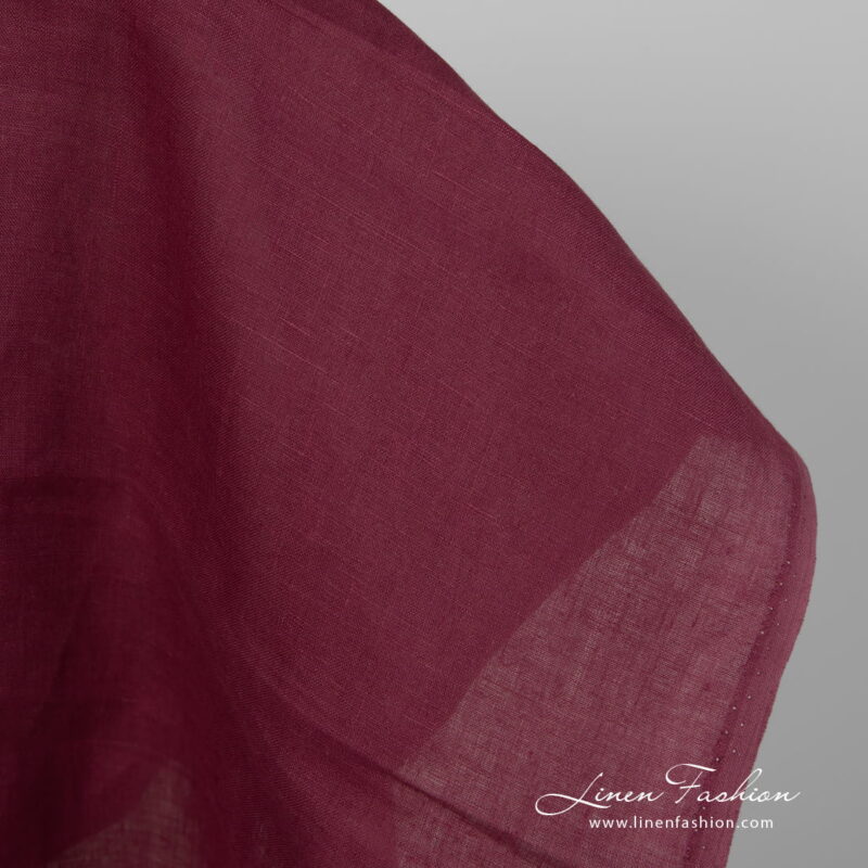 Linen fabric deep cherry colour edge view